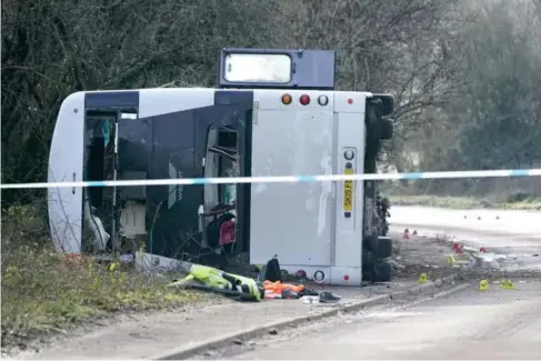  ?? (PA) ?? T he scene on the A39 in somerset after a doub l e - decker bus overturned