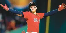  ?? MICHAEL DWYER/AP ?? The Red Sox’s Alex Verdugo celebrates after his walk-off home run during the ninth inning of a May 1 game against the Toronto Blue Jays at Fenway Park. Verdugo is off to a strong start to the season.