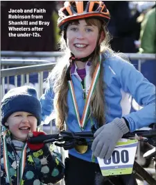  ??  ?? Jacob and Faith Robinson from Shankill and Bray Wheelers after the under-12s.