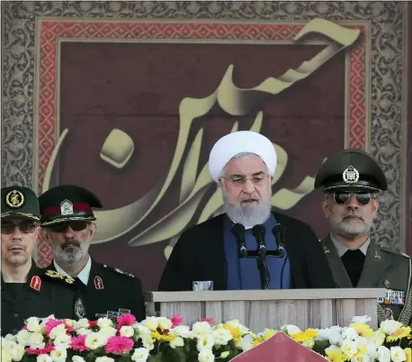  ?? IRANIAN PRESIDENCY OFFICE VIA AP ?? In this photo released by the official website of the office of the Iranian Presidency, President Hassan Rouhani speaks at a military parade marking 39th anniversar­y of outset of Iran-Iraq war, in front of the shrine of the late revolution­ary founder Ayatollah Khomeini, just outside Tehran, Iran, Sunday.