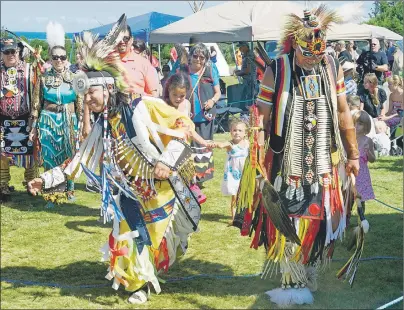  ?? MITCH MACDONALD/THE GUARDIAN ?? Noel Julian, left, and One Breath Mitchell dance while dressed in regalia at the 24th annual Abegweit Powwow held at the Panmure Island Cultural Park this weekend. Julian is a member of the host drum band East Boyz from Eskasoni, N.S.