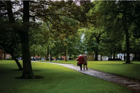  ?? (Getty) ?? Rising cases: an elderly couple walk through Blackburn town centre