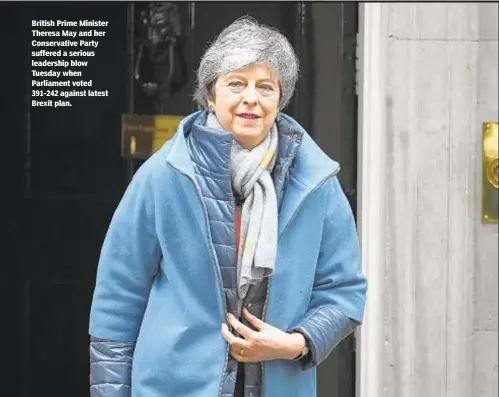  ??  ?? British Prime Minister Theresa May and her Conservati­ve Party suffered a serious leadership blow Tuesday when Parliament voted 391-242 against latest Brexit plan.