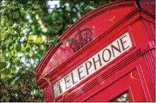 ?? MILES WILLIS / BLOOMBERG ?? The iconic red phone boxes that were a staple on many British streets began disappeari­ng in the
1980s. Now, however, they’re making a comeback of sorts.