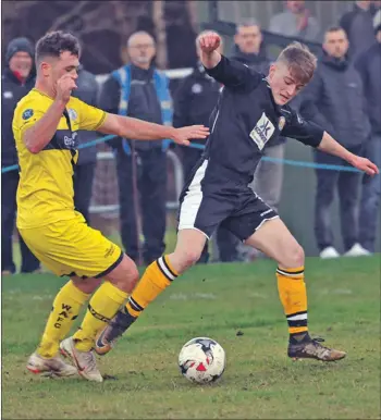  ??  ?? Fort William’s Aiden Taylor retains possession.