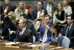  ?? THE ASSOCIATED PRESS ?? Matthew Rycroft, left, Britain’s Ambassador to the U.N., and U.S. Ambassador Nikki Haley vote Friday in favor of a resolution at United Nations headquarte­rs. The council is voting on proposed new sanctions against North Korea, including sharply lower...