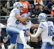  ?? CHARLES REX ARBOGAST — THE ASSOCIATED PRESS ?? Detroit Lions tight end Brock Wright (89) celebrates his two-yard touchdown reception with quarterbac­k Jared Goff (16) and Tom Kennedy (85) during the first half of last Sunday’s game against the Chicago Bears in Chicago.