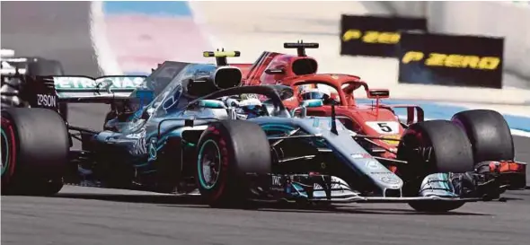  ?? AFP PIC ?? Mercedes AMG Petronas’ Valtteri Bottas (front) and Ferrari’s Sebastian Vettel collide at the start of the French GP in Le Castellet on Sunday.