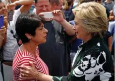  ?? AARON P. BERNSTEIN/REUTERS ?? Hillary Clinton meets a supporter in Ashland, Ohio on Sunday.