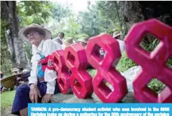  ?? —AFP ?? YANGON: A pro-democracy student activist who was involved in the 8888 Uprising looks on during a gathering for the 30th anniversar­y of the uprising at the University of Yangon.