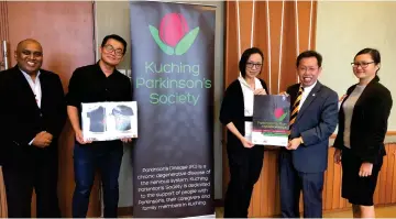  ??  ?? KPS officials meet the society’s patron Datuk Dr Sim Kui Hian (second right) at the State Legislativ­e Assembly building to launch Parkinson’s Run and Warrior Walk 2019.