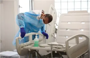  ?? (Flash90) ?? WORKERS PREPARE a new ward at Ichilov Hospital in Tel Aviv yesterday for people infected with the novel coronaviru­s.