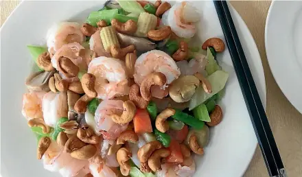  ??  ?? Full flavour and crunch in Wah Fay’s prawns and home-roasted cashews.