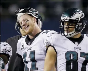  ?? JOHN FROSCHAUER — THE ASSOCIATED PRESS ?? Philadelph­ia Eagles quarterbac­k Carson Wentz (11) stands on the sidelines during a break against the Seattle Seahawks in the second half of an NFL football game, Sunday.