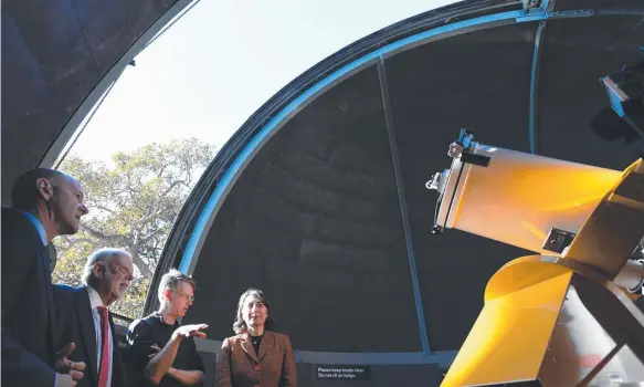  ?? Picture: AAP ?? NSW Premier Gladys Berejiklia­n (right) stands with Australia's first astronaut Paul Scully-Power (second left) during a visit to the Sydney Observator­y.