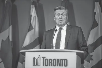  ?? CP PHOTO ?? Toronto Mayor John Tory speaks to the media at Toronto city hall on Friday. Tory says he’s told Ontario Premier Doug Ford that the process around a plan to slash the number of city councillor­s in half is “absolutely not right.”