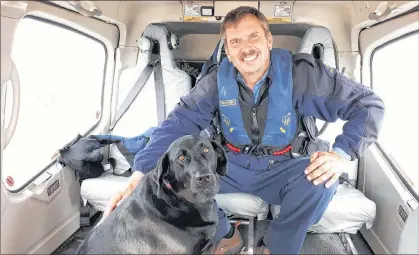  ?? ADAM RANDELL/THE CENTRAL VOICE ?? After a 28-day stint, principal lightkeepe­r Craig Burry and Molly, his three-year-old black Labrador retriever, head home to Wesleyvill­e to spend time with family.