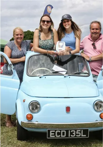  ?? ?? Classic car winners Julie Hitchcock, Hannah Taylor, Lydia Hitchcock, and Colin Hitchcock, from left, with their blue Fiat 500.A 1966 Singer Gazelle with Terry Wood. Picture: Dijana Capan/DVision