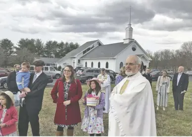  ?? BY JOHN MCCASLIN ?? Father Tuck Grinnell, seen here following Easter Sunday Mass on April 1, has announced his retirement from parish ministry.