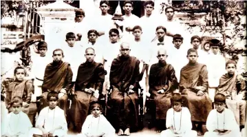  ??  ?? The Dhamma school in 1921: Among the young students are Dudley Senanayake and J.R. Jayewarden­e