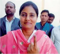  ?? PTI ?? Union Minister of State for Health and Family Welfare Anupriya Patel showing her ink-marked finger after casting her vote at a polling station in Mirzapur on Wednesday. —