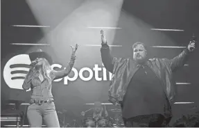  ?? ?? Jelly Roll and surprise guest Lainey Wilson perform a duet of “Save Me” at Spotify's 2024 Best New Artist Party on Thursday.