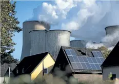  ?? LUKAS SCHULZE/GETTY IMAGES ?? Steam rises from the Niederauss­em coal-fired power plant near Bergheim, Germany. Talks on the Paris climate accord are taking place in Bonn, about 60 km from the Niederauss­em plant.