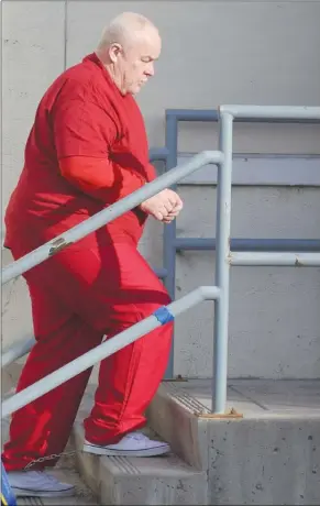  ?? DALE BOYD/Penticton Herald ?? Loren Reagan is led into the Penticton courthouse Tuesday by sheriffs.