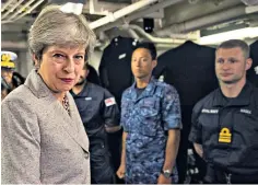  ??  ?? ‘Not a quitter’: Theresa May during a visit to Yokosuka Naval Base in Japan