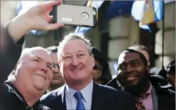  ?? MATT ROURKE — THE ASSOCIATED PRESS ?? Newly sworn in Philadelph­ia Mayor Jim Kenney, center, stops for a selfie as he takes the sidewalk from his inaugurati­on to City Hall Monday in Philadelph­ia. The 57-year-old Kenney succeeds Michael Nutter, who leaves office after two terms. Kenney...