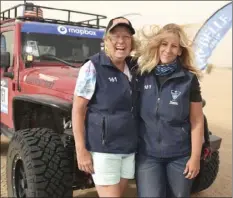  ??  ?? Amy Volmer (right) and Robyn Garrison (left), who rode together as Team Fireworks 161, pose at the finish line in Glamis after competing in the Rebelle Rally off-road competitio­n from Oct. 12 to Oct. 21. AMY VOLMER COURTESY PHOTO