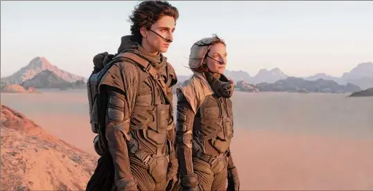  ?? Photos by Chia Bella James / Warner Bros. Pictures via Associated Press ?? Timothee Chalamet, left, and Rebecca Ferguson in a scene from "Dune." The movie is based on the 1965 novel by Frank Herbert.