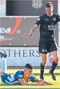  ?? SNS. ?? Cammy Kerr, main picture, has put the controvers­y over Jordan Jones’ dive to earn Killie a penalty, above, on the back-burner as he looks forward to working under new Dens boss Jim McIntyre, pictured top in training.