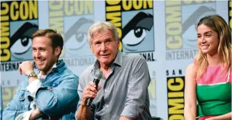  ??  ?? Ryan Gosling, from left, Harrison Ford, and Ana de Armas attend the Warner Bros. "Blade Runner" panel on day three of Comic-Con Internatio­nal. — AP