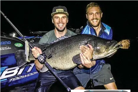  ?? PHOTO: CONTRIBUTE­D ?? NICE CATCH: Carl Jocumsen (left) and Kris George with their 124-centimetre cod beast caught at Cooby Dam on a Megabass Magdraft 8-inch plastic.