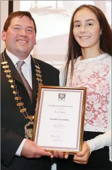  ??  ?? Cathaoirle­ach of Sligo County Council, Cllr. Martin Baker making a presentati­on to Ava Glancy who was 2nd Sean nós Dancing at the All Ireland Fleadh.