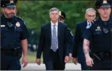  ?? The Associated Press ?? ESCORTED: Ambassador William Taylor, is escorted by U.S. Capitol Police on Oct. 22, as he arrives to testify before House committees as part of the Democrats impeachmen­t investigat­ion of President Donald Trump, at the Capitol in Washington.