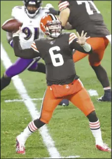 ?? John Kuntz/ Cleveland.com ?? Cleveland Browns quarterbac­k Baker Mayfield throws a pass against the Baltimore Ravens in the first quarter on Monday Night Football, December 14, 2020, at FirstEnerg­y Stadium.