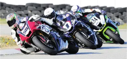  ?? Picture: Eric Buijs. ?? NEW WINNER. Michael White (Consortium Shipping Yamaha), leads Clinton Seller (Neolife Yamaha) and Greg Gildenhuys (Transport.co.za Kawasaki) in Saturday’s second SuperGP race at Aldo Scribante.