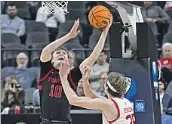  ?? David Becker Associated Press ?? MAX MURRELL of Stanford shoots against Utah’s Branden Carlson during the Pac-12 tournament.