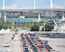  ?? SUSAN STOCKER/SOUTH FLORIDA SUN SENTINEL ?? Drivers line up for COVID-19 testing at the Hard Rock Stadium in Miami Gardens on Thursday.