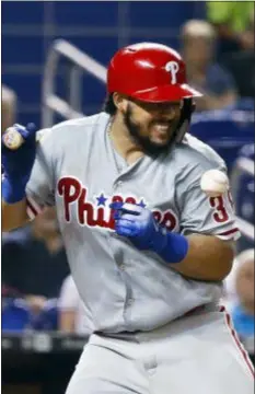  ?? BRYNN ANDERSON — THE ASSOCIATED PRESS ?? The Phillies’ Jorge Alfaro reacts after he was hit by a pitch from Miami Marlins’ Sandy Alcantara during the seventh inning Wednesday in Miami.