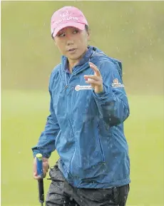  ?? ANDY BUCHANAN/AFP/GETTY IMAGES ?? I.K. Kim sits first after two rounds of the Women’s British Open Golf Championsh­ip in St. Andrews, Scotland.