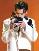  ?? CHRIS PIZZELLO/AP ?? Harry Styles accepts the award for best pop vocal album for “Harry’s House” Sunday in Los Angeles.