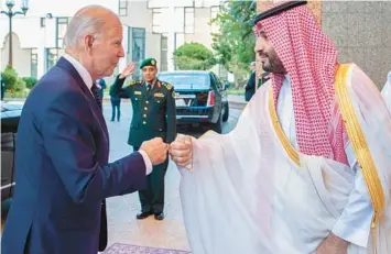  ?? BANDAR ALJALOUD/SAUDI ROYAL PALACE ?? President Joe Biden and Saudi Crown Prince Mohammed bin Salman greet each other by bumping fists before their anticipate­d and carefully planned meeting Friday at Al-Salam palace in Jeddah, Saudi Arabia.