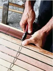  ??  ?? Making bamboo blinds by hand is a dying craft as there are few apprentice­s who want to learn the skills.
