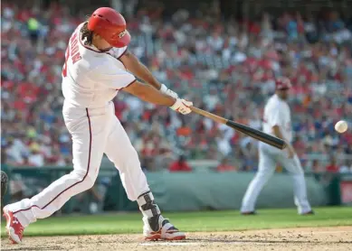  ?? (Photo by Nick Wass, AP) ?? Washington Nationals' Anthony Rendon singles during the seventh inning of Sunday's game against the New York Mets.