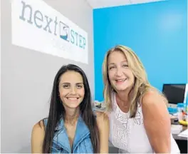  ?? RICARDO RAMIREZ BUXEDA/STAFF PHOTOGRAPH­ER ?? Amanda Perla, left, who was paralyzed in a 2007 car accident, handles social media for her mom, Liza Perla-Riedel, at the NextStep Orlando paralysis rehabilita­tion facility.