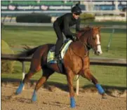  ?? CHARLIE RIEDEL — THE ASSOCIATED PRESS ?? Kentucky Derby hopeful Justify runs during a morning workout at Churchill Downs Tuesday in Louisville, Ky. The 144th running of the Kentucky Derby is scheduled for Saturday, May 5.