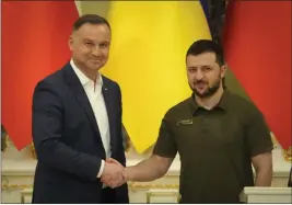  ?? EFREM LUKATSKY — THE ASSOCIATED PRESS ?? Ukrainian President Volodymyr Zelenskyy, right, and Polish President Andrzej Duda shake hands during a news conference after their meeting in Kyiv, Ukraine, Sunday.